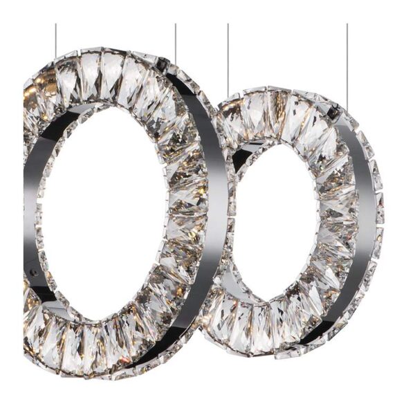 Close up of two crystal pendant lights on a white background.