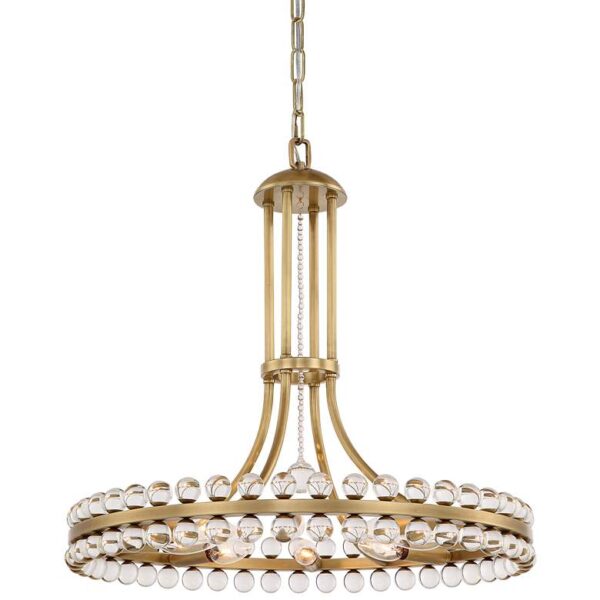 A brass chandelier with clear glass beads hanging from a white ceiling.