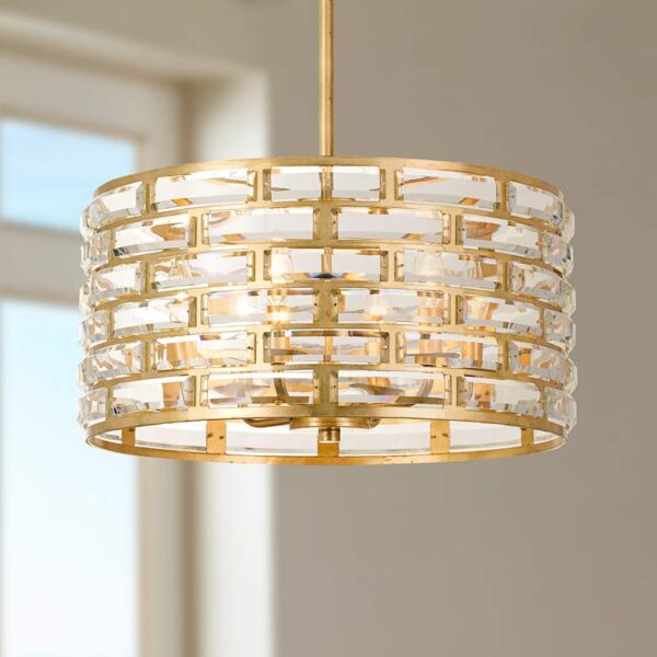 A Crystorama Meridian 6 Light Antique Gold Chandelier hanging from the ceiling in a room.