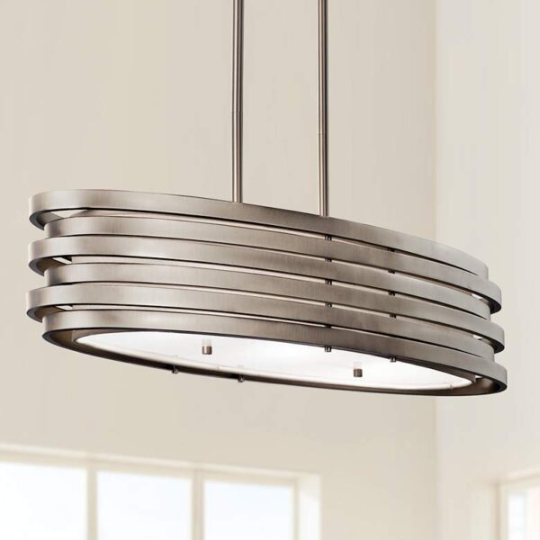 A modern pendant light with a white glass shade hanging from a chain on a black ceiling.