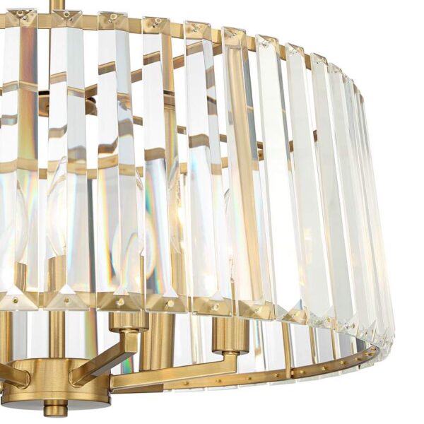 Close-up of a gold chandelier with clear crystals.