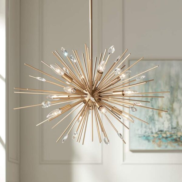 A close-up of a gold chandelier with a sunburst design. The chandelier has multiple golden rods extending from a central sphere in every direction, creating a sunburst-like shape.