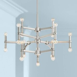 A modern stainless steel chandelier with clear glass shades hanging from the ceiling in a living room.