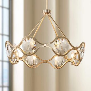 A chandelier with eight arms, each of which is adorned with crystals. The chandelier is made of gold and has a distressed finish.