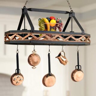 A pot rack hanging from the ceiling with pots and pans.