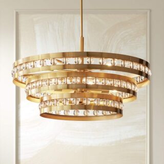 A chandelier made of crystal rings, suspended from a metal frame.