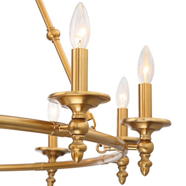 Close up of a brass chandelier with candles on a white background.