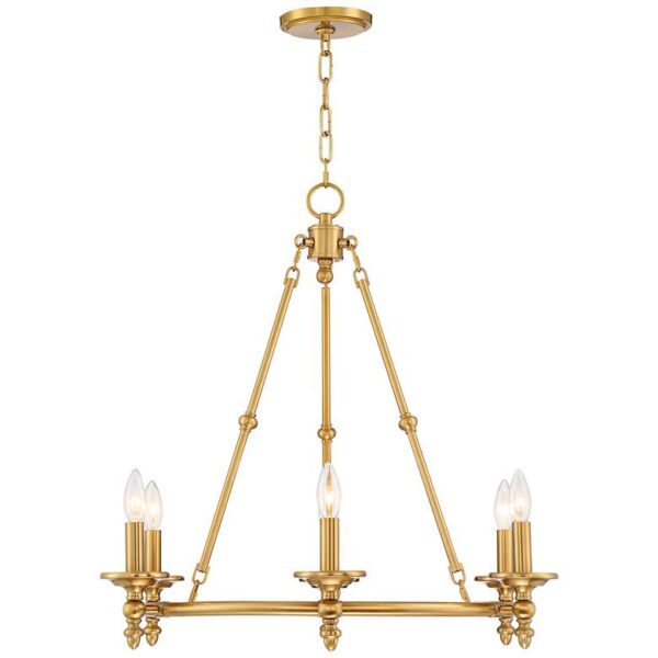 A brass chandelier with eight candles hanging from it, suspended from the ceiling.